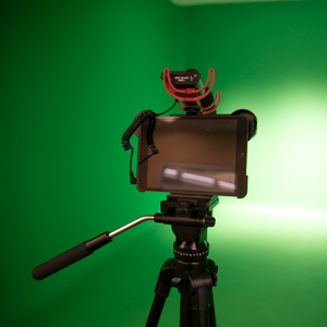 camera in front of a green screen
